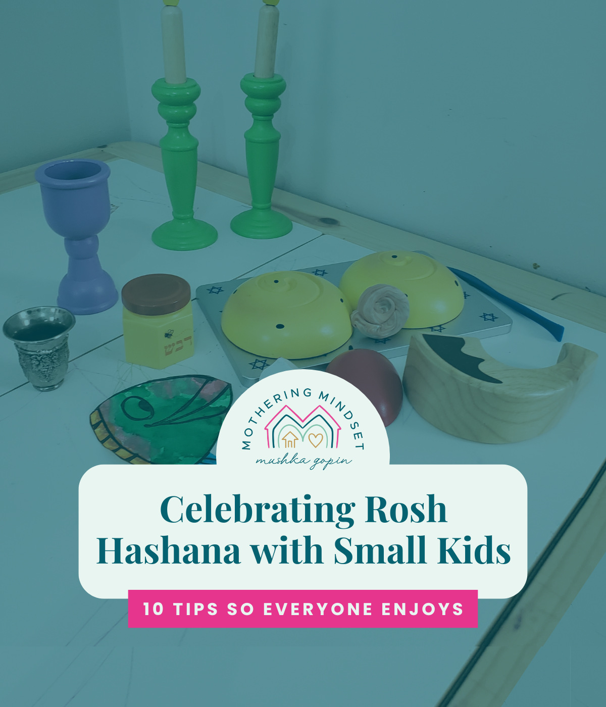 image shows a kids table set with wooden Rosh Hashana foods and reads "Celebrating Rosh Hashana with Small Kids"